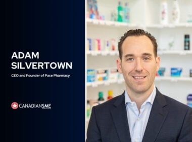 A man in a suit smiles at the camera inside a pharmacy. Text on the left reads: Adam Silvertown, CEO and Founder of Pace Pharmacy. The Canadians SME logo is also displayed. Shelves with medicine are visible in the background.
