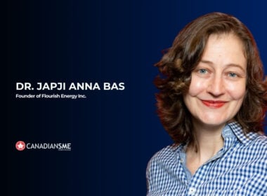 A woman smiling for a picture.