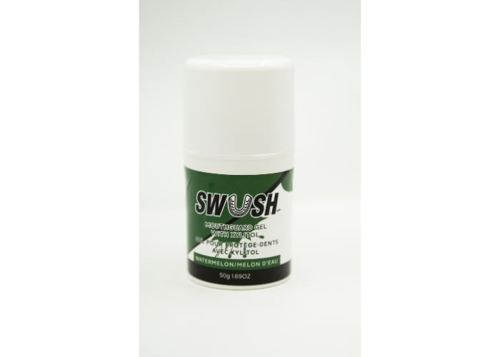 A white and green container of SWOSH toothpaste gel with xylitol, watermelon, and melon flavor, standing upright on a plain white background. The label has a leaf design.