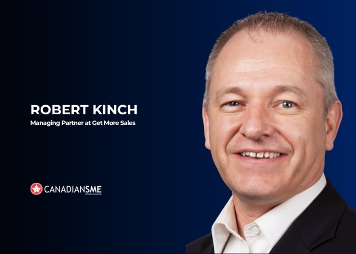 Close-up portrait of a smiling man in a suit and white shirt on a dark blue background. Text reads: Robert Kinch, Managing Partner at Get More Sales and Canadian SME with a logo.