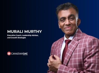 A man in a checked suit poses confidently against a dark blue background. Text reads: Murali Murthy, Executive Coach, Leadership Advisor, and Growth Strategist. The CanadiansSME logo is at the bottom left.